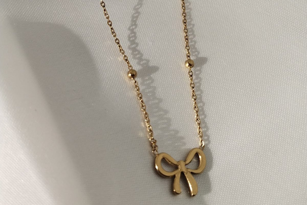 Wrapped in Gold: The Allure of the Ribbon Necklace
